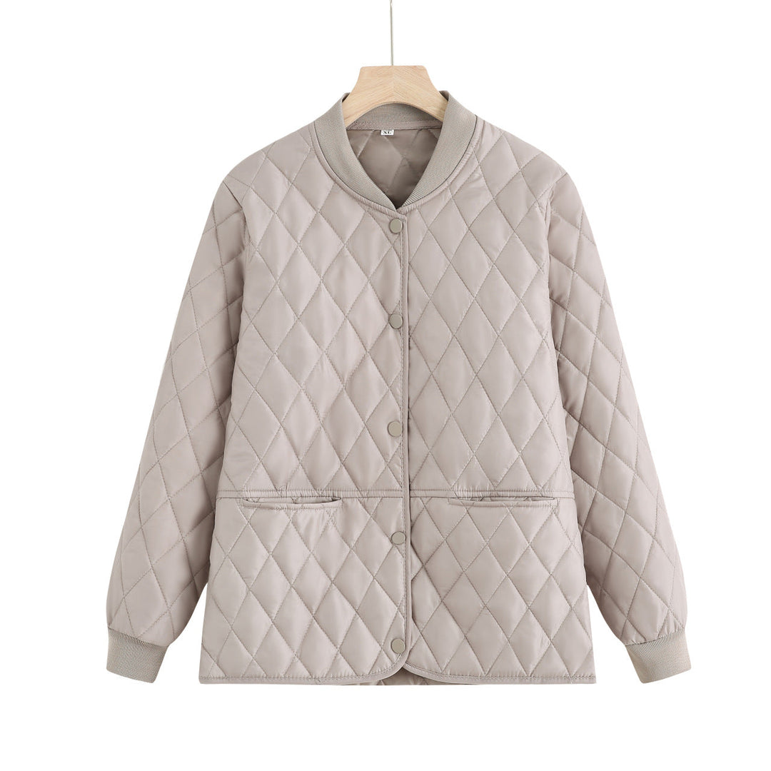 Dam quiltad övergångsjacka med diamond stitching och ribbed krage