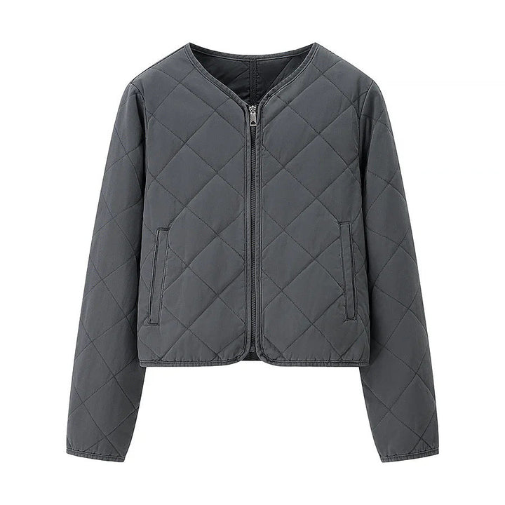 Dam kort jacka i boxy skärning med diamond quiltning, rounded fåll och concealed dragkedja