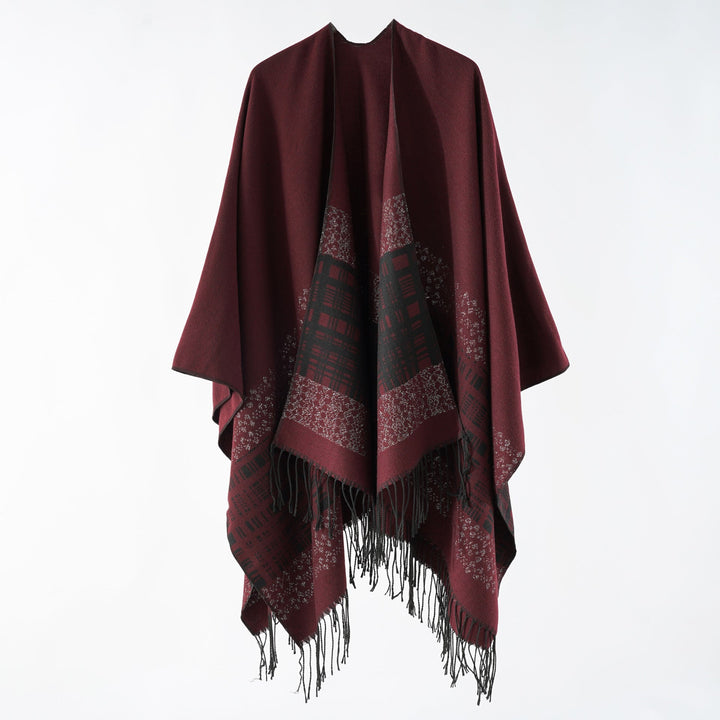 Dam ullblandning axel poncho med jacquard mönster och fransfåll