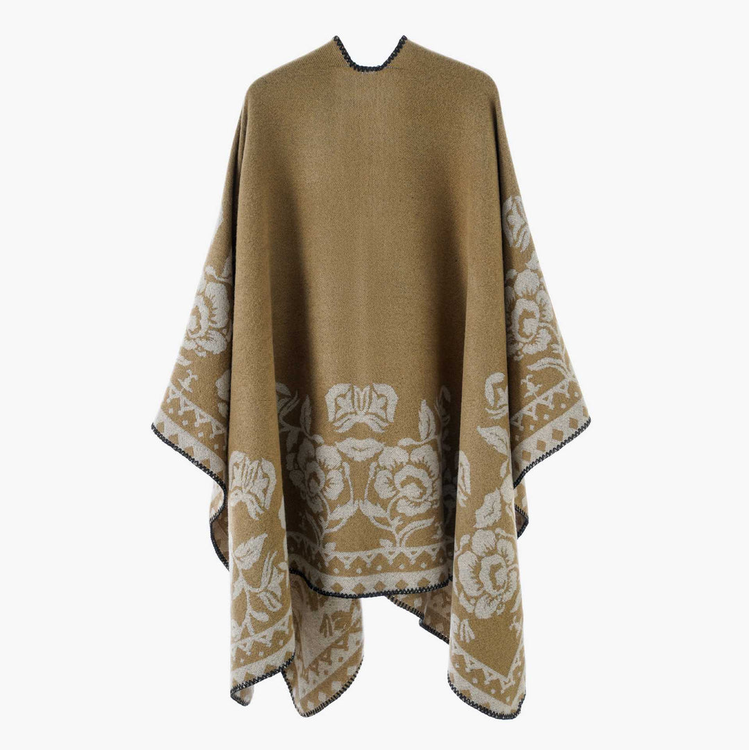Dam poncho med floral jacquard structure och fine overlock seam