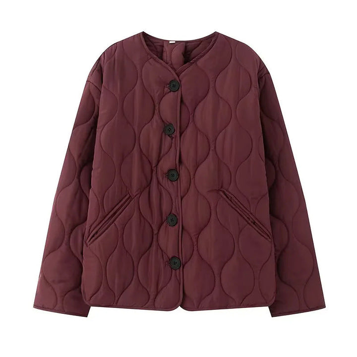 Dam quiltad övergångsjacka med organic wave quiltning, knäppning, och inserted sidofickor