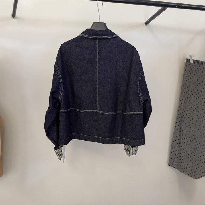 Dam kort skärning denimjacka med kontrasterande rutig muddar