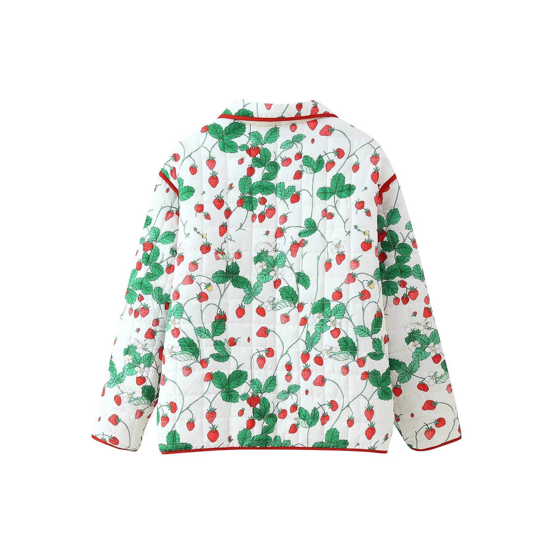 Dam quiltad övergångsjacka med strawberry motif, kontrasterande piping, och stor påsydda fickor
