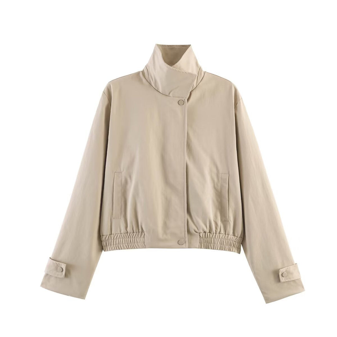 Dam kort skuren minimalistisk blouson jacka gjord mjuk vegan läder med a slagkrage och elastic fåll