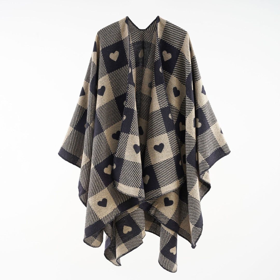 Dam capeponcho tillverkad av jacquard stickad med heart alla-över och öppen front