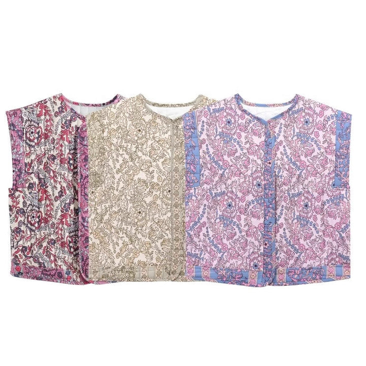 Dam quiltad väst med blommig design och praktiska fickor