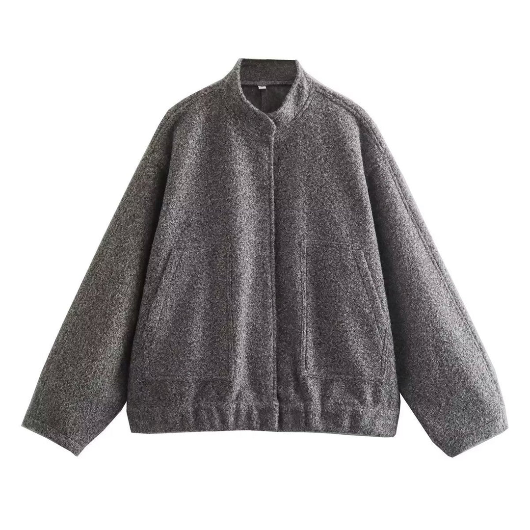 Dam oversized teddy kappa med ståkrage, påsydda fickor, och straight fåll