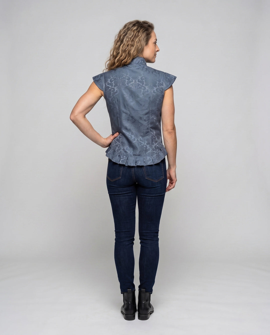 Dam elegant kviltad väst med intricate embellishments