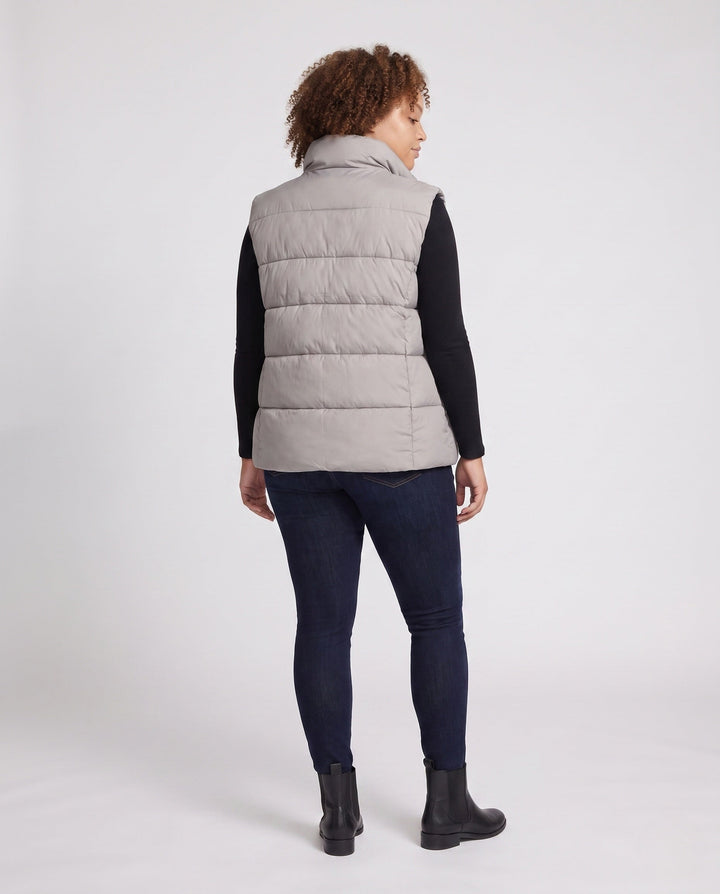 Dam Lätt Vadderad Sleeveless Quiltad Väst med Hög Stå Krage, Two-Way Dragkedja och Justerbar Drawstring Nederkant.