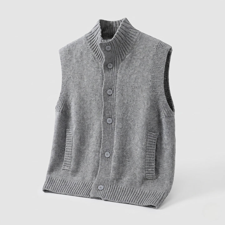 Dam ärmlös structured knit väst med hög ribbed krage, dold knappslå och inset fickor